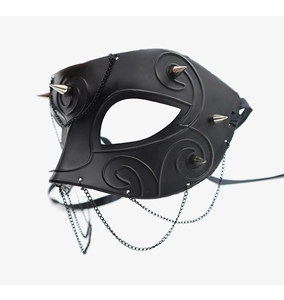 Detail of matte black half face mask with silver punk spikes and metallic chains