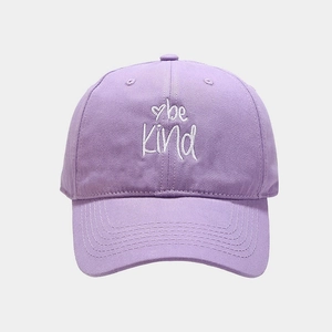 Detail of lavender cotton baseball cap with white 'be kind' embroidery and heart