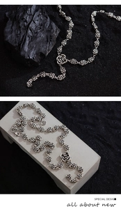 Detailed macro view of S925 sterling silver vintage rose necklace with floral links