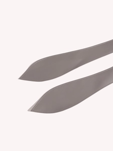 Detail of taupe leather wrap belt with refined stitching and elegant pointed ends