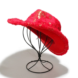 Detail of red plush cowboy hat with gold sequin snowflakes for Christmas party decor