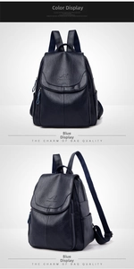 Detailed view of dark blue pebbled leather backpack showing side pockets and flap texture