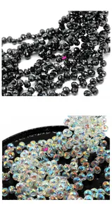 Macro shot of faceted strawberry crystal beads in black and iridescent AB colors
