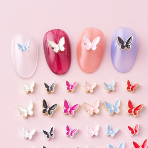 Alloy butterfly nail charms in various colors and sizes for DIY manicure decoration