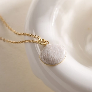 18K gold plated necklace featuring a white shell pendant with pearl luster on a chain