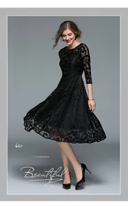 Detailed view of elegant black floral lace fabric on a long A-line dress for women