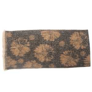 Detailed view of dark grey floral scarf with beige flower pattern and fringe edges