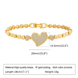 Detail of gold heart bracelet showing 20mm heart charm size and 18cm chain length specs