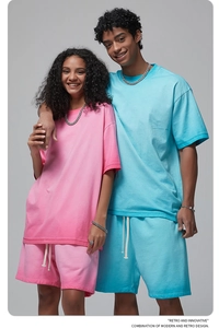 Detail of couple in pink and light blue matching heavy cotton t-shirt and shorts sets