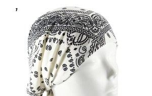 Detail of pre-tied headscarf with black and white paisley print on stretch fabric