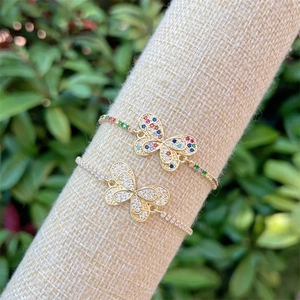18k gold plated butterfly bracelet set with colorful zircons on a display roll