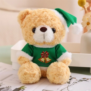 Close-up of a teddy bear in a green Christmas sweater with festive holiday patterns