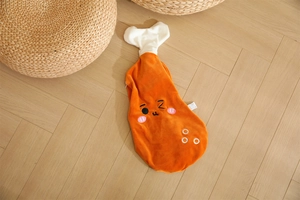 Detailed close-up of cartoon chicken leg plush shell with zipper and embroidery