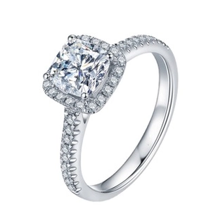 Close-up of a silver ring featuring a large square zircon center stone with halo setting