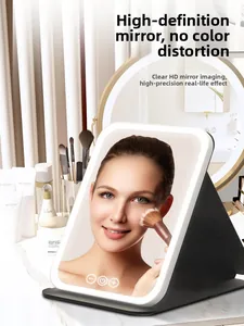 Detail of portable foldable LED makeup mirror showing touch controls and soft lighting