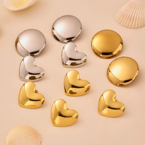 Polished stainless steel round and heart earrings set in gold and silver mirror finish