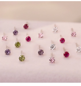 Macro shot of 999 silver cubic zirconia stud earrings in multiple vibrant colors