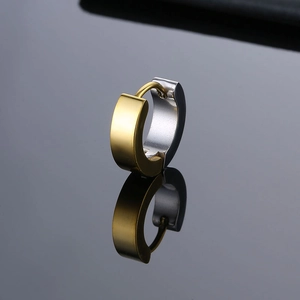 Minimalist gold and silver two-tone stainless steel hinged hoop earrings on black mirror surface