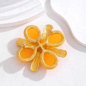 Baroque golden flower brooch with yellow oval stones and brushed metal back pin