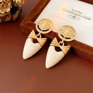 Vintage gold bow heart earrings with rhinestone details and cream enamel drops