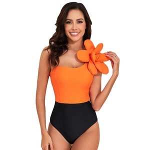 One-piece swimsuit for women with 3D orange flower and vibrant color-block design