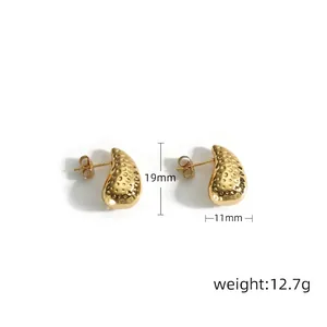 Detail of gold water drop earrings showing hammered texture and dimensions 19mm by 11mm