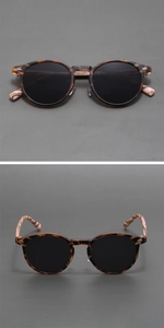Close-up of retro matte round sunglasses with faux wood grain and anti-UV lenses