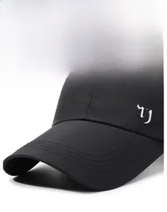 Close-up of gothic NY embroidery on a black quick-dry breathable baseball cap side