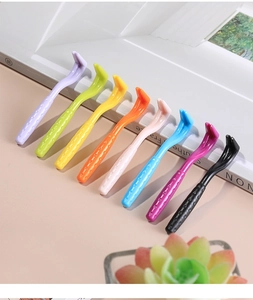 Detailed view of plastic pet tick removal hooks in eight vibrant colors for dogs and cats