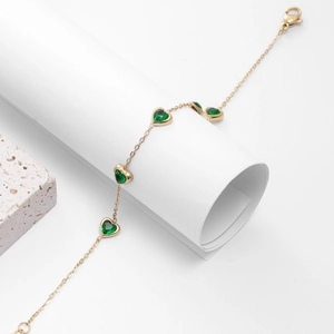 Elegant gold-plated stainless steel bracelet with green heart-shaped zircons and lobster clasp
