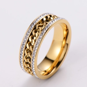 Macro detail of gold-plated twisted chain ring featuring double-row clear zircon stones