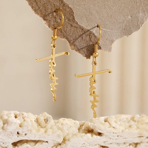 Golden FAITH cross dangle earrings for women in stainless steel with a polished finish