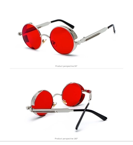 Detail view of steampunk sunglasses with red round lenses and spring temple design