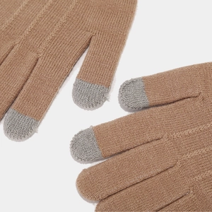 Detail of warm camel knitted gloves with grey touchscreen fingertips for cold weather