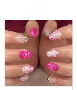 Short almond press-on nails with rose red leopard, snake patterns and star accents