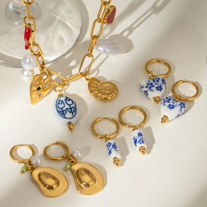 Gold stainless steel ocean necklace set with ceramic flower pendants and pearls