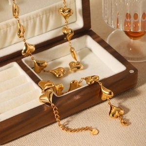 18K gold-plated stainless steel necklace featuring multiple hollow heart pendants on a chain