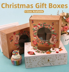 Macro view of Christmas bakery gift boxes with clear windows and festive snowman patterns