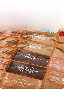 Detail of transparent food packaging bags with various patterns and jagged tear notch edges