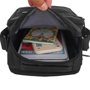 Waterproof Oxford fabric crossbody bag showing interior storage for tablets and phones