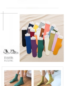 Colorful cotton blend crew socks for women featuring ribbed cuffs in various vibrant solid colors