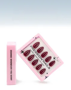 Detail of burgundy almond fake nails in a pink box showing the glossy 30pcs set
