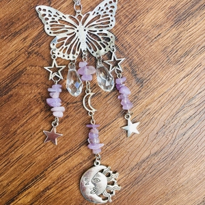 Detailed silver butterfly suncatcher with stars, crescents and purple crystal beads