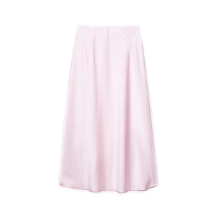Detailed view of soft pink midi skirt showing smooth satin texture and light sheen