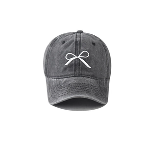 Vintage charcoal grey washed cotton baseball cap with white bow embroidery and curved brim