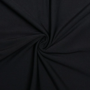 Macro shot of black elastic fabric texture with soft spiral folds and premium drape finish