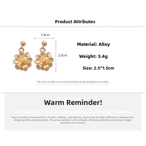 Detailed view of 2.5x1.5cm gold flower earrings with petal texture and 5.4g alloy weight