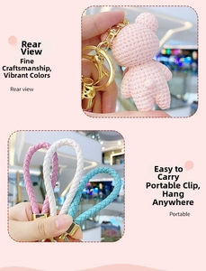 Rear view of pink woven bear keychain with golden metal clasp and colorful straps
