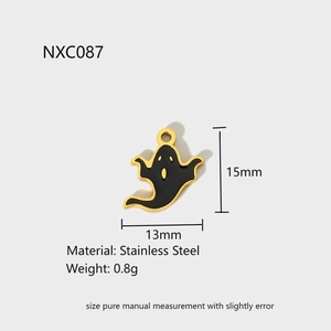 Detail view of a 15mm black enamel ghost charm pendant in stainless steel with gold edges