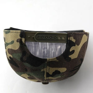 Detail view of the camouflage baseball cap with an adjustable green snapback strap